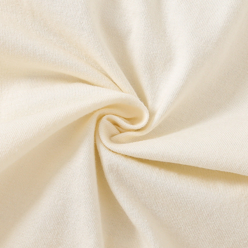 Close-up of beige fabric with a subtle swirl pattern