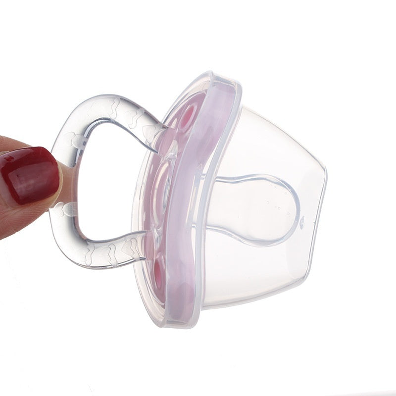 Clear baby pacifier held by a hand with red nail polish on a white background
