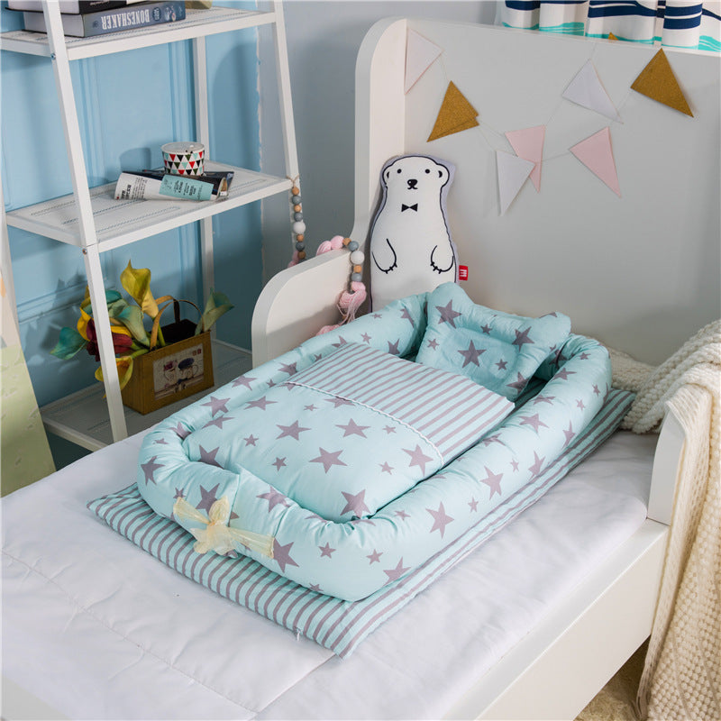 Baby crib with star-patterned bedding in a child's room
