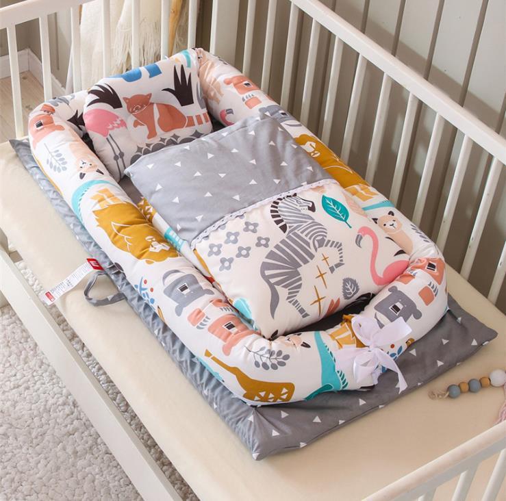 Baby crib bumper with animal patterns on a crib