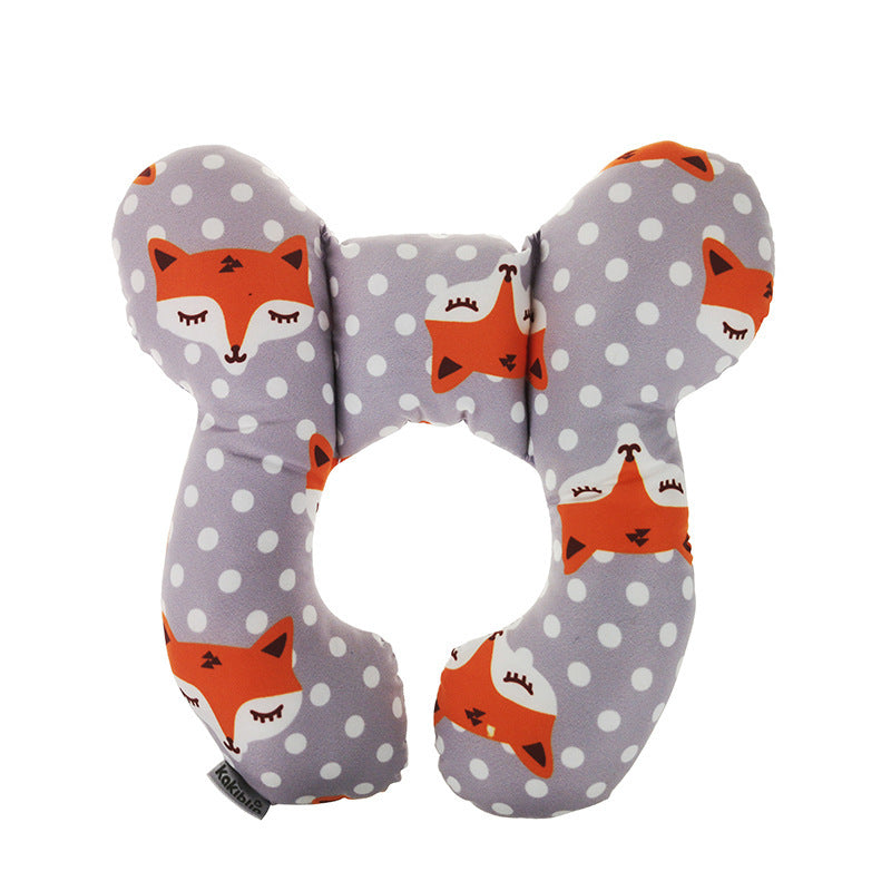 U-shaped pillow with fox pattern on a gray background