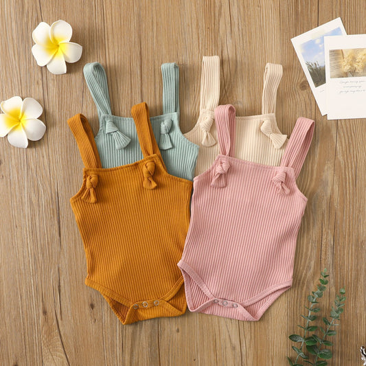 Cotton baby romper with adjustable straps in beige - front view