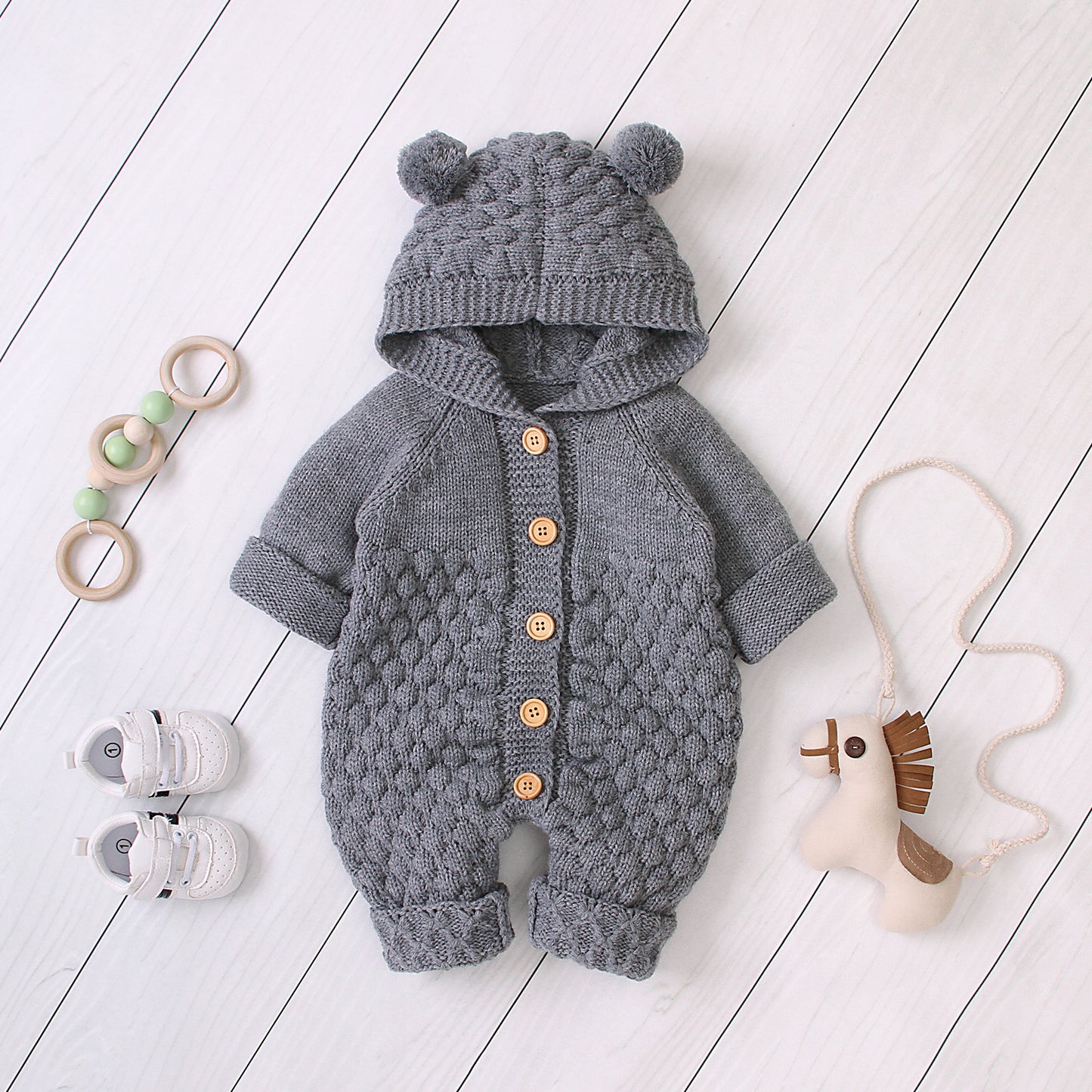 Baby in comfortable hooded knit jumpsuit available in sizes 66cm to 90cm
