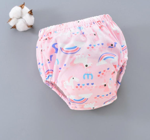 Pink baby bloomers with animal print on a gray background