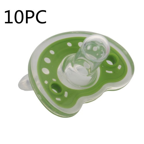 Green pacifier with white dots on a white background