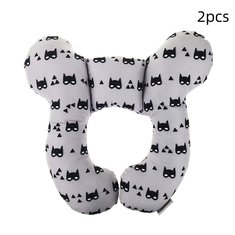 Two U-shaped neck pillows with black cat masks pattern on a white background