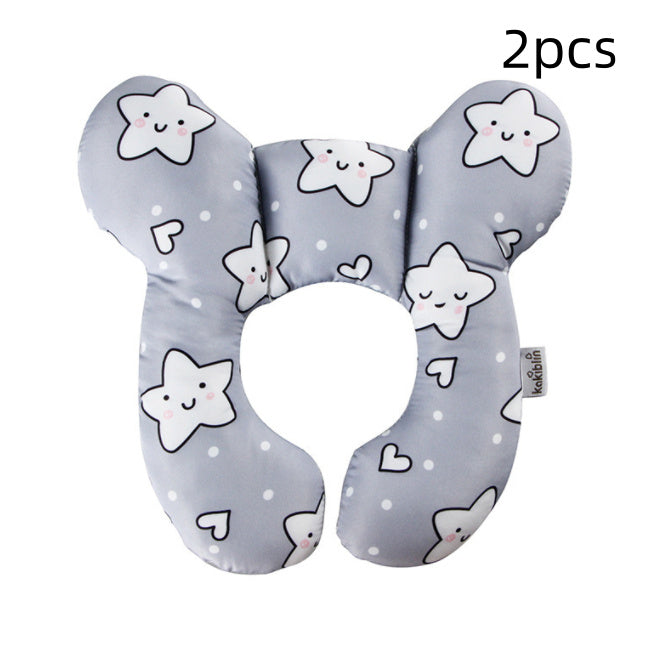 Two gray U-shaped neck pillows with star and heart patterns on a white background.