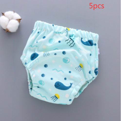 Two baby diapers with whale pattern on a gray background