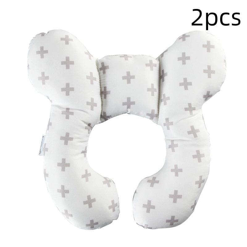 Two white neck pillows with gray cross patterns on a white background