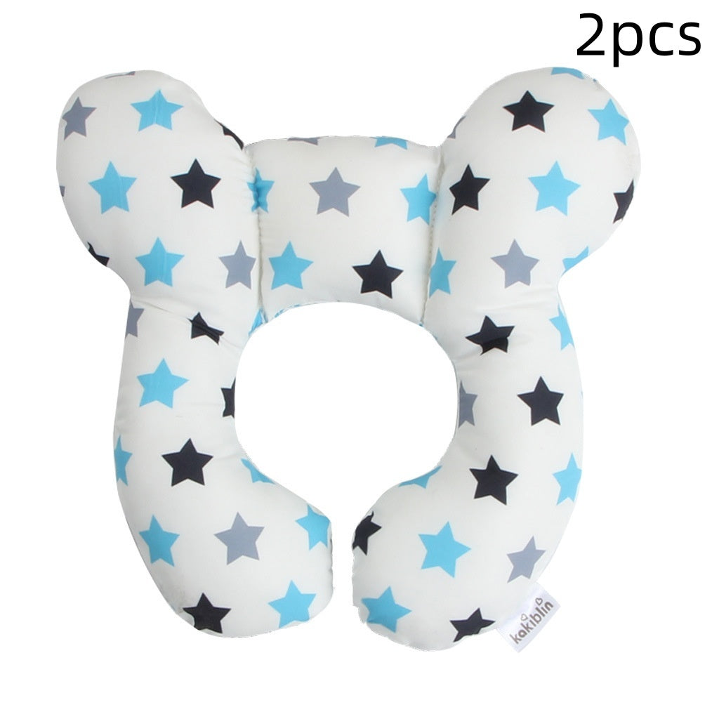 Two U-shaped baby pillows with star pattern on a white background