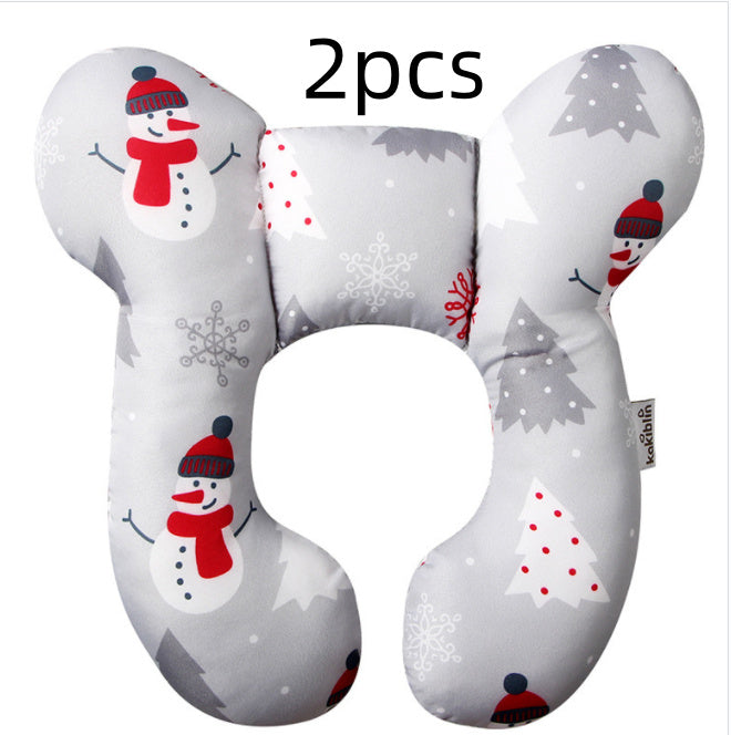 Two U-shaped travel pillows with snowman and Christmas tree designs on a white background.