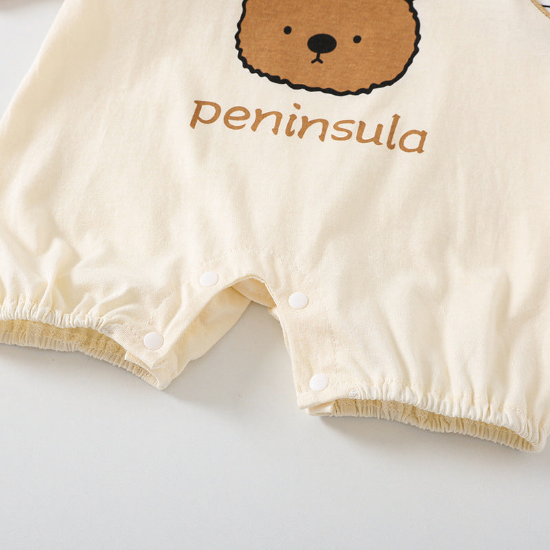 Beige baby romper with bear design and 'peninsula' text on a light gray background