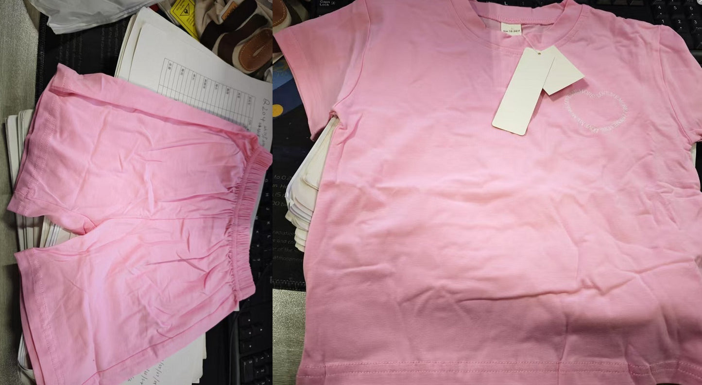 Pink t-shirt with a tag on a table