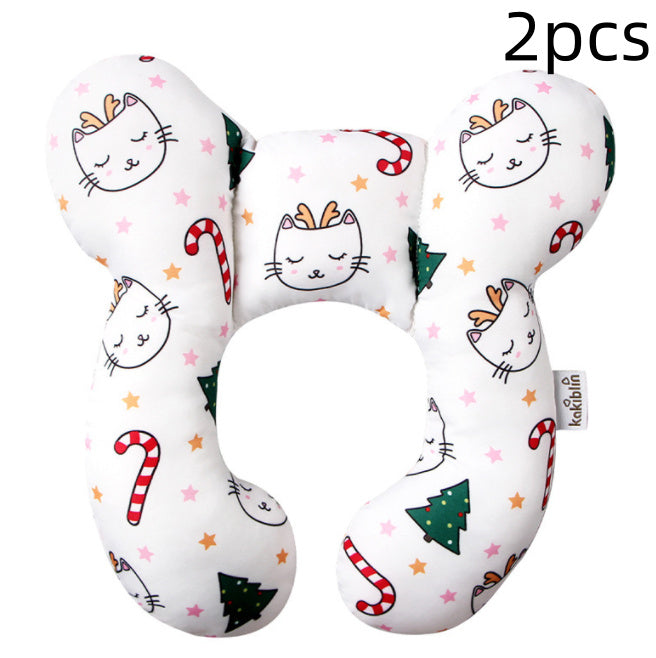 Two U-shaped pillows with cat and Christmas tree patterns on a white background
