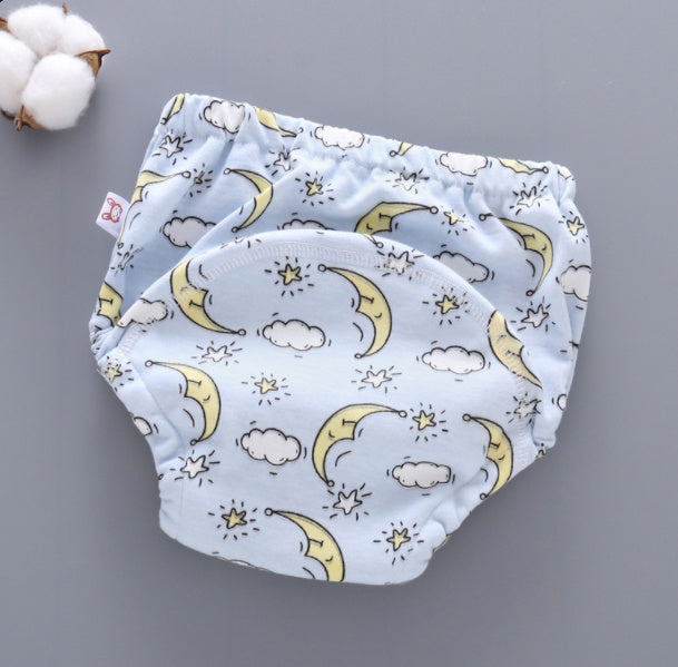 Baby cloth diaper with moon and star pattern on a gray background