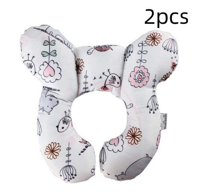 Two U-shaped baby pillows with floral and animal patterns on a white background.
