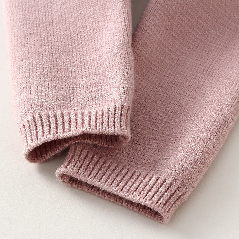 Close-up of pink knitted pants on a light background