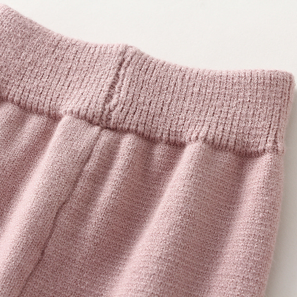 Close-up of pink textured fabric with a white background