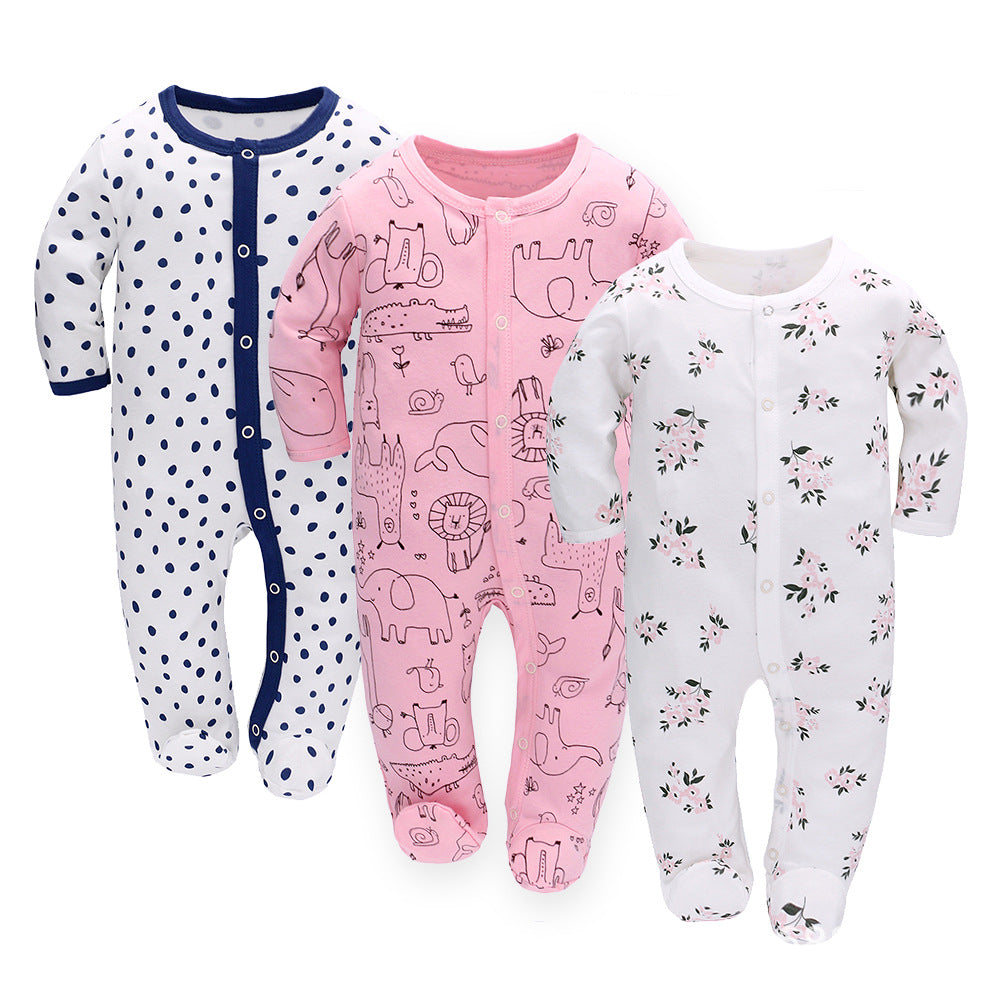 Three baby onesies with different patterns