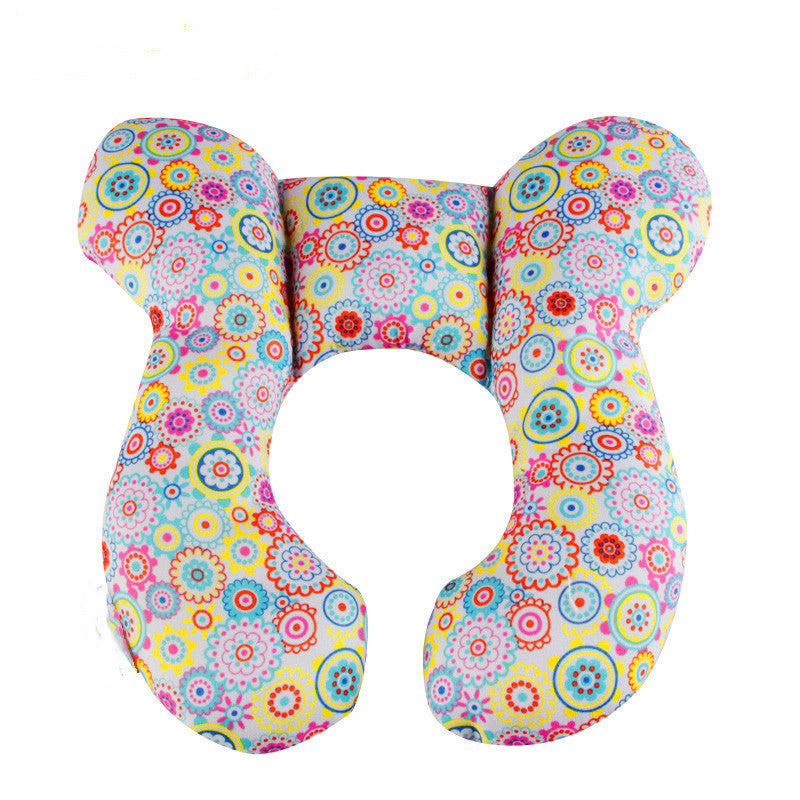 Colorful floral-patterned U-shaped pillow on a white background