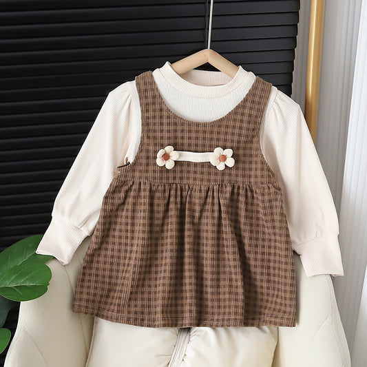 Baby girl wearing dark coffee plaid long sleeve dress set with matching shirt
