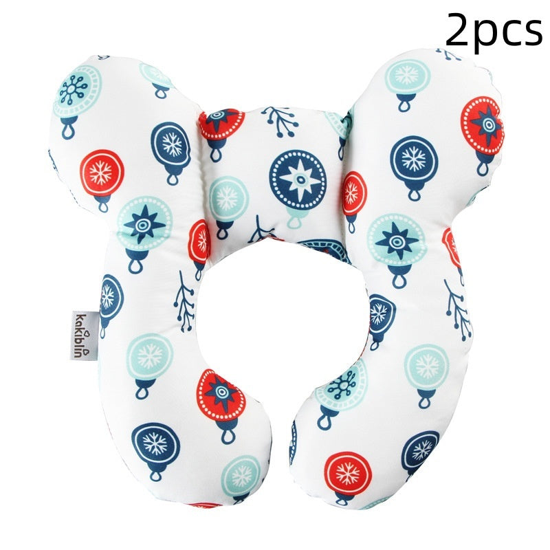 Two U-shaped neck pillows with colorful patterns on a white background