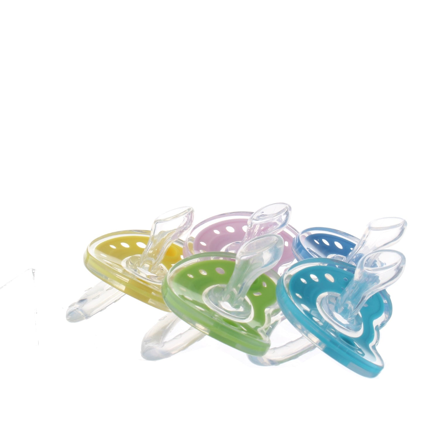 Set of colorful baby pacifiers on a white background