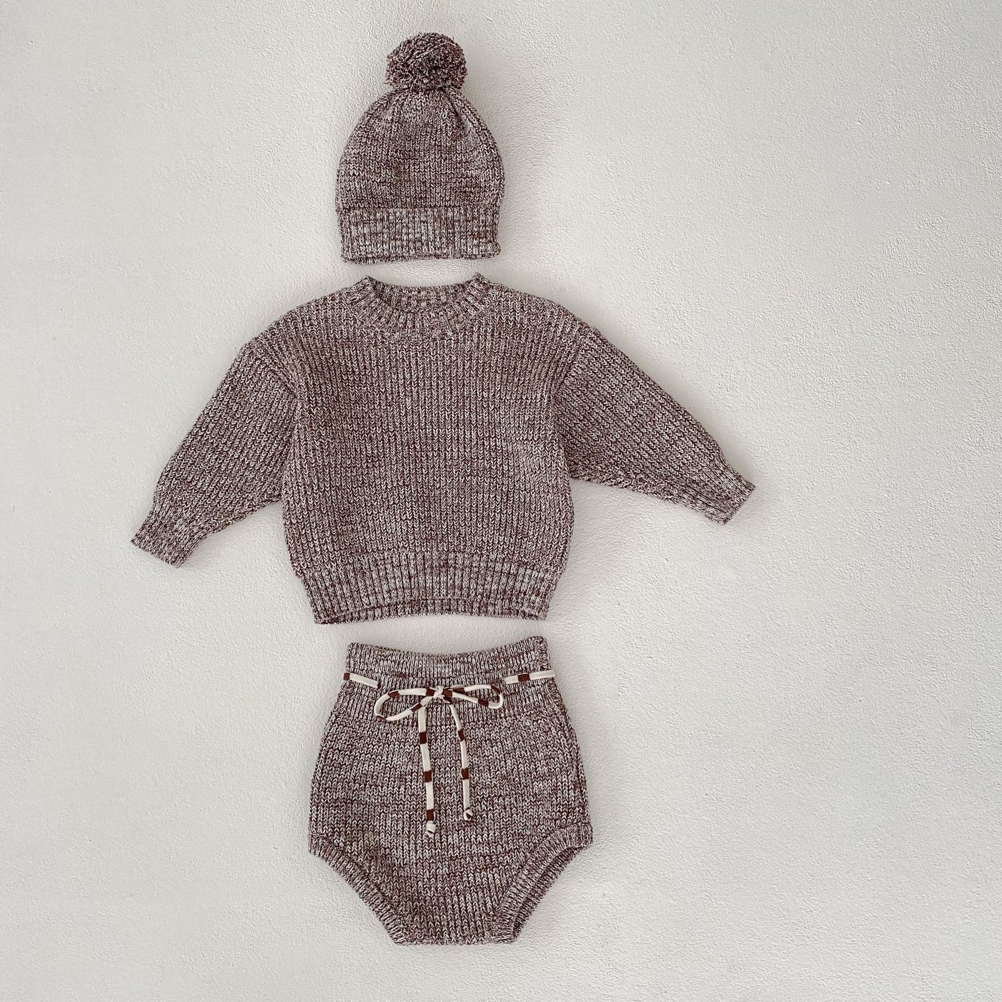 Baby girl wearing sophisticated knit outfit set ideal for special occasions and family photos