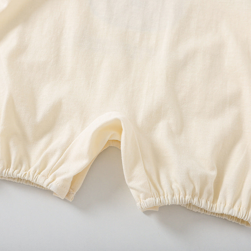 Close-up of beige shorts on a light gray background