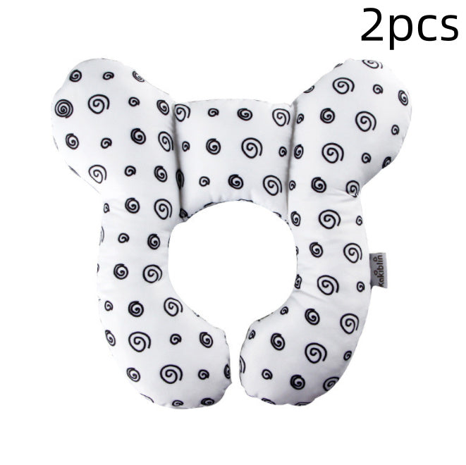 Two U-shaped travel neck pillows with black spiral pattern on a white background