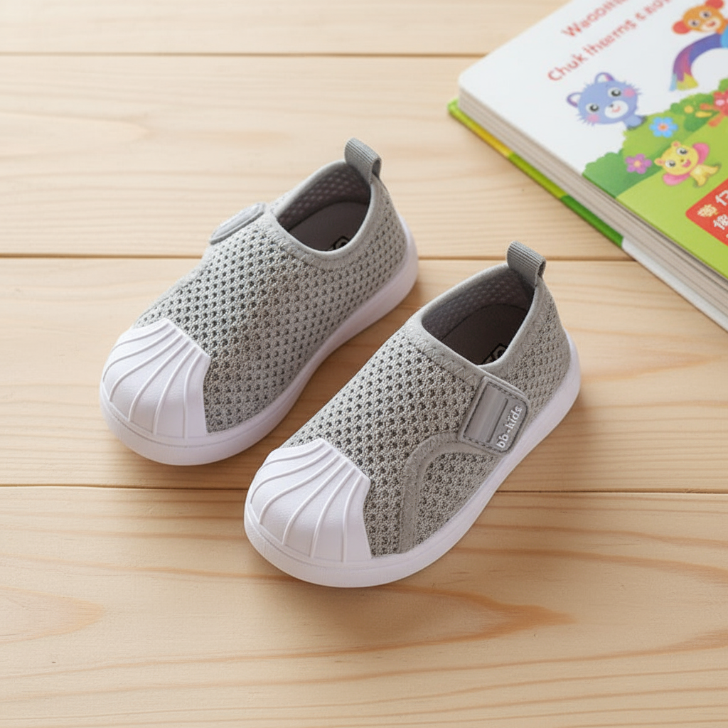 Gray Shoes on Wooden Surface with Magazine